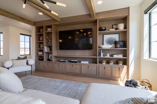 5366 Cyan Lane St. George, UT 84790 - Photo 28 of 39 Living area featuring built in shelves, recessed lighting, wood finished floors, and beam ceiling