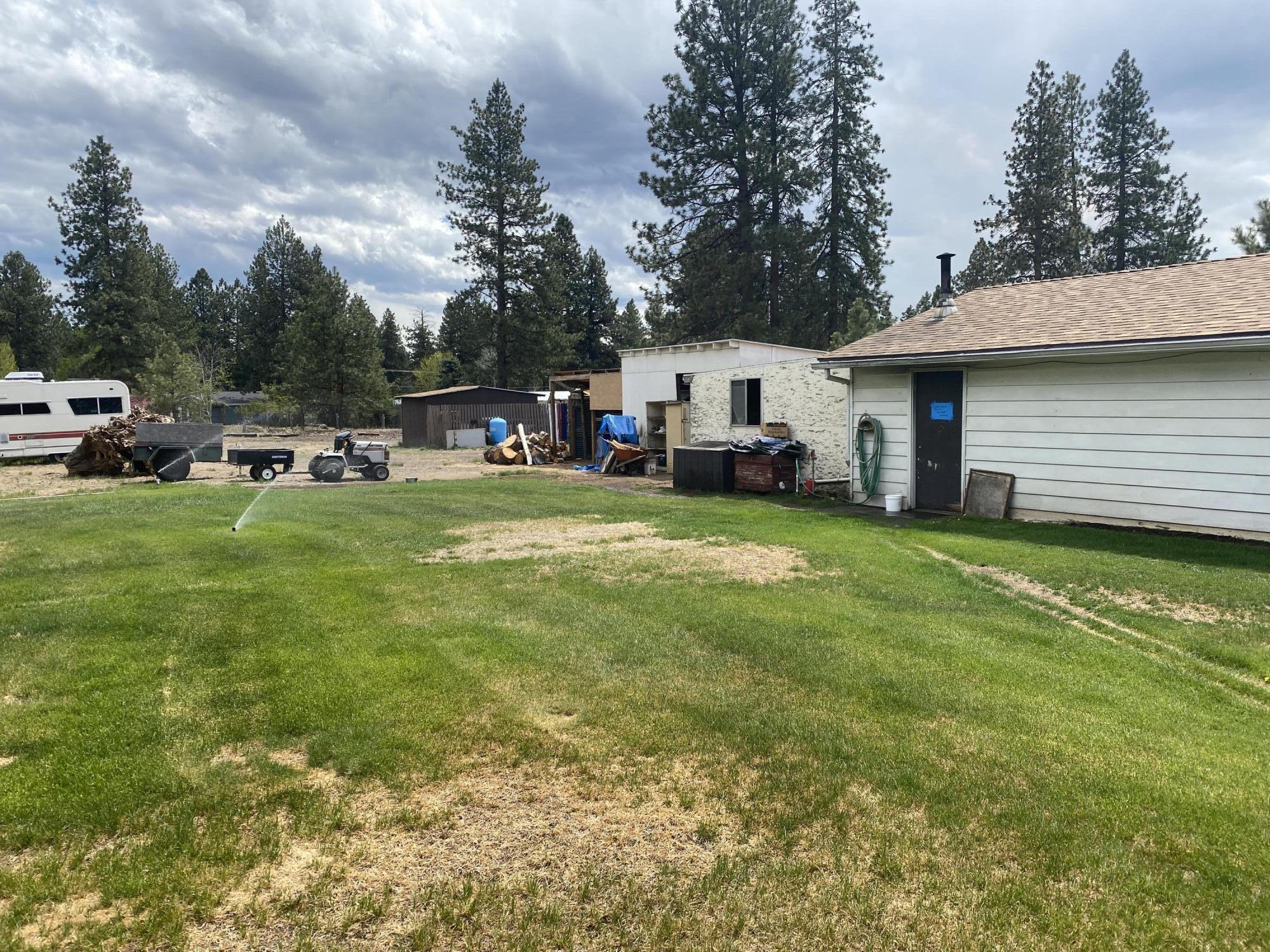 19553 Apache Road Bend, OR 97702 - Photo 9 of 18 a view of a house with a back yard
