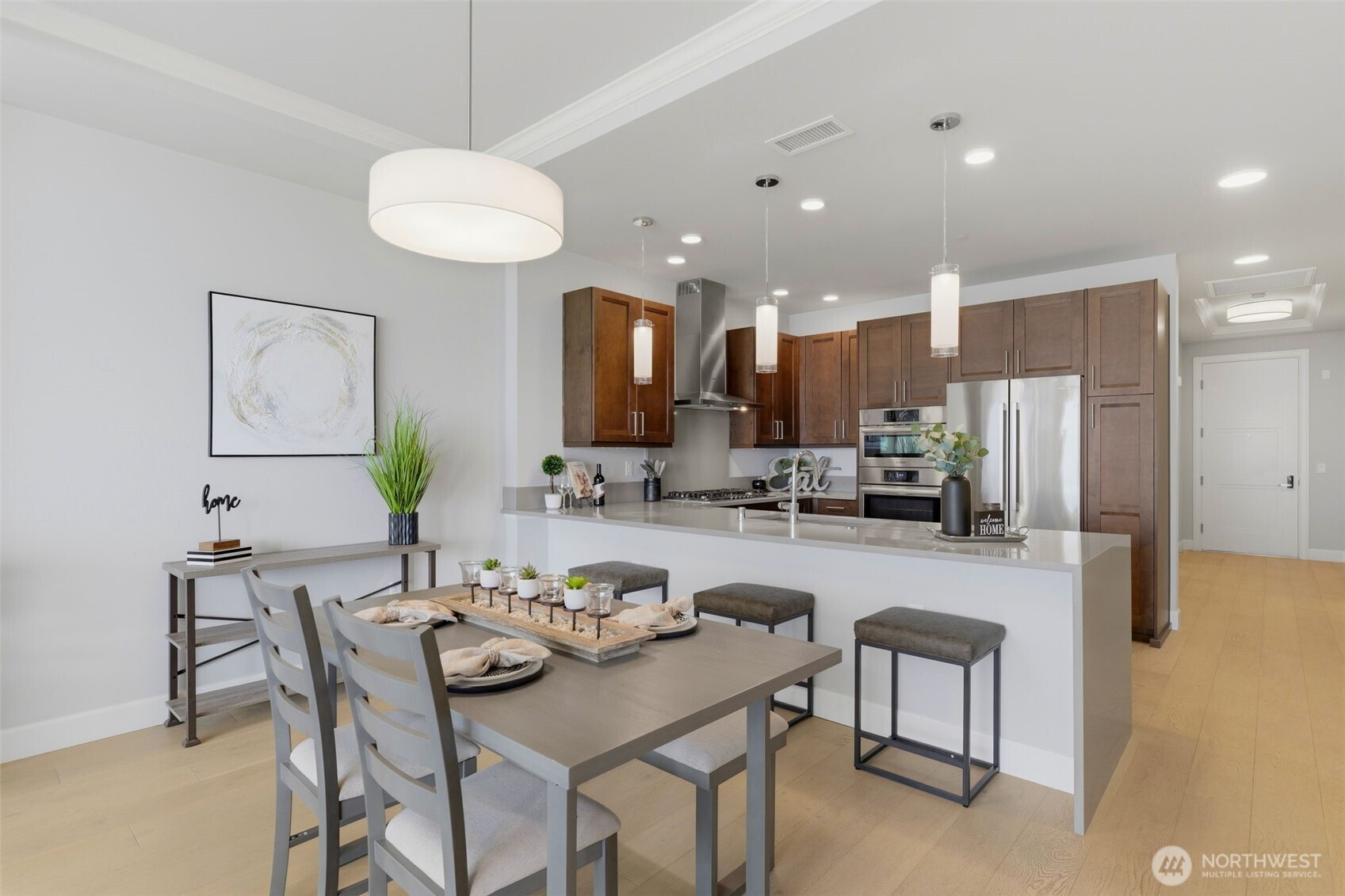 4907 Main Street, Unit 214 Tacoma, WA 98407 - Photo 8 of 34 a kitchen with a table and chairs in it