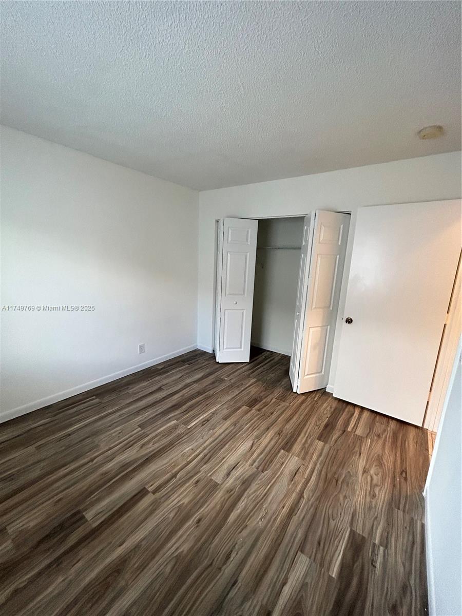 The Ridges Weston, FL 33331 - Photo 30 of 51 a view of empty room with wooden floor