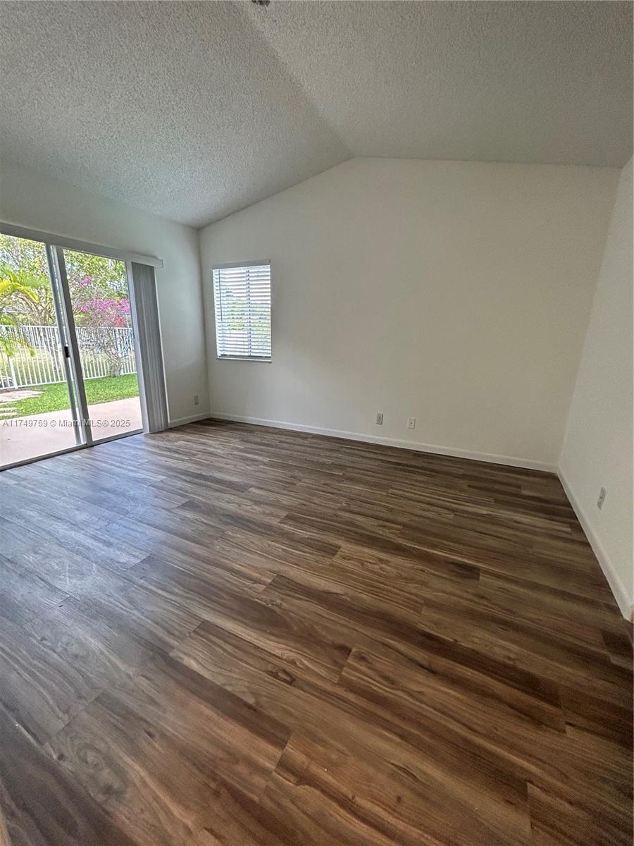 The Ridges Weston, FL 33331 - Photo 36 of 51 a view of an empty room with wooden floor and a window
