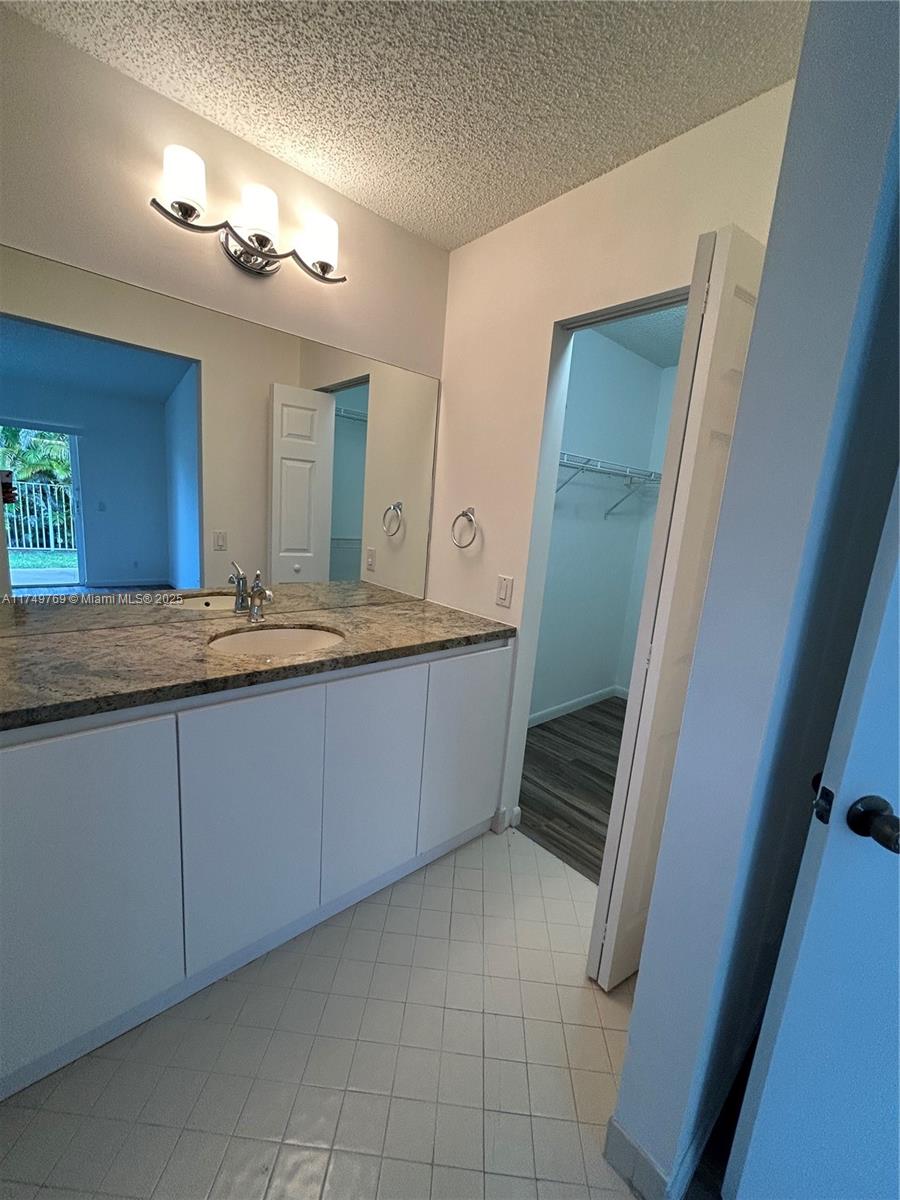 The Ridges Weston, FL 33331 - Photo 38 of 51 a bathroom with a sink and a mirror