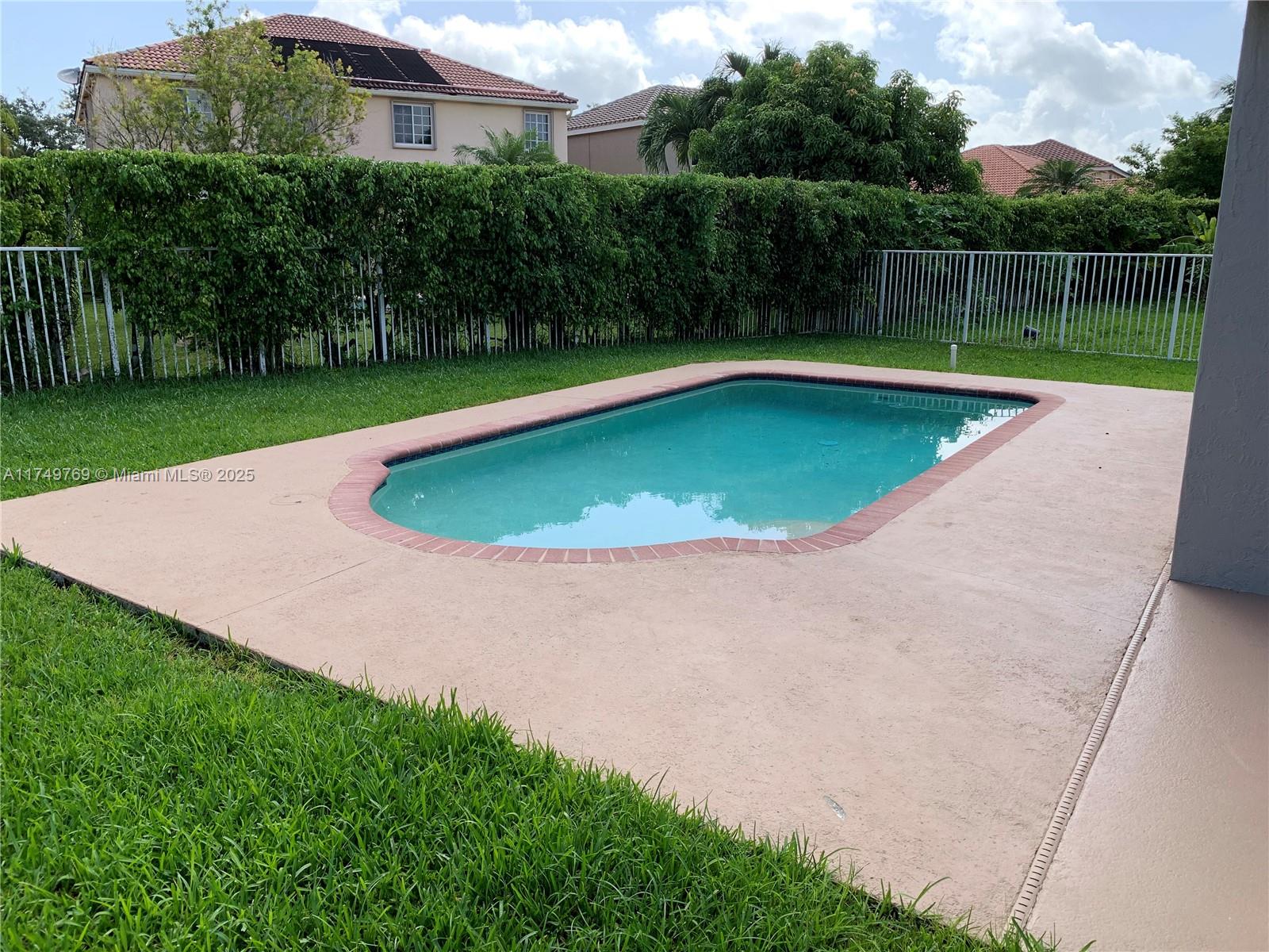 The Ridges Weston, FL 33331 - Photo 46 of 51 a view of a swimming pool and a yard