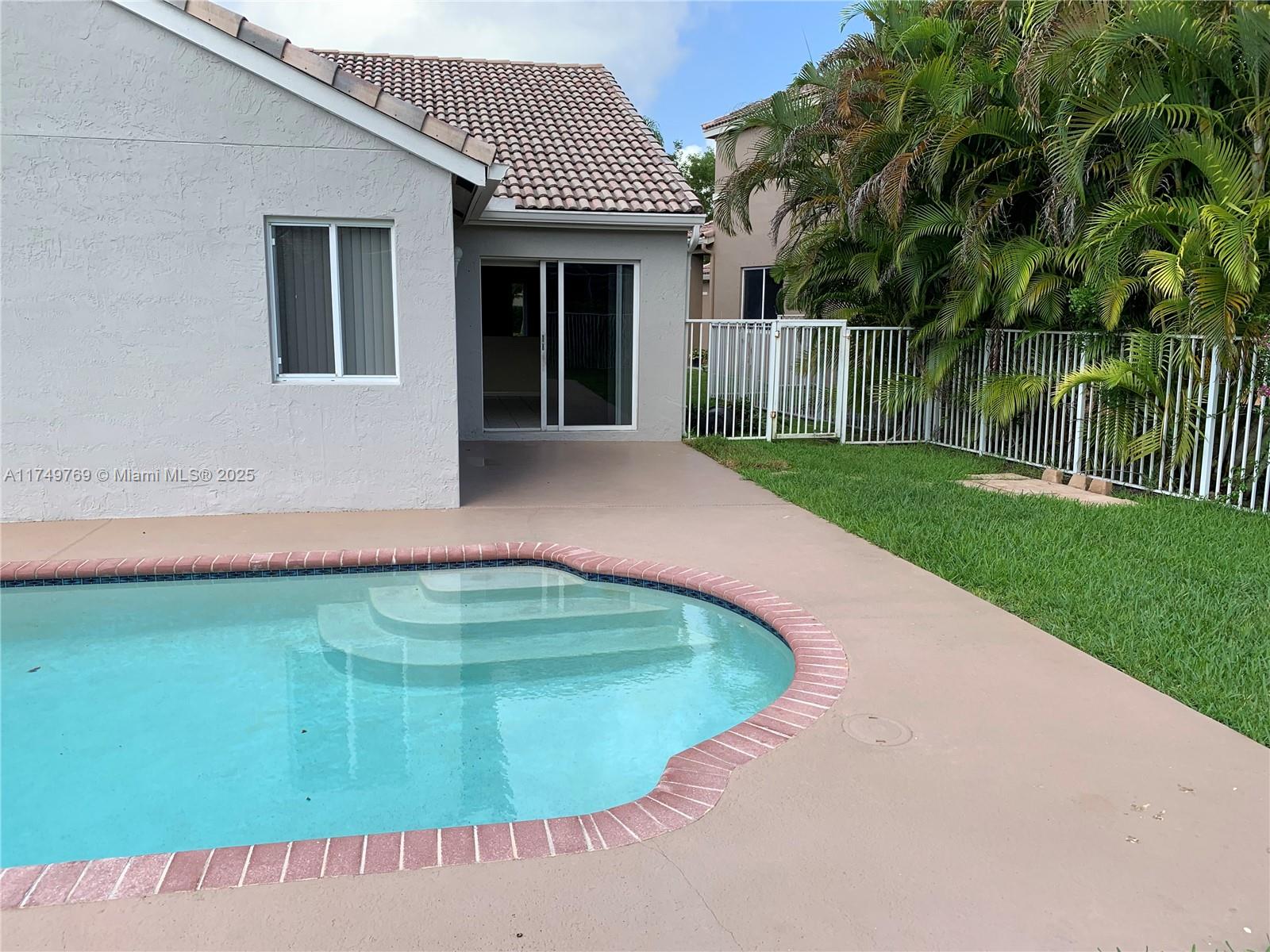 The Ridges Weston, FL 33331 - Photo 48 of 51 a view of a house with a swimming pool