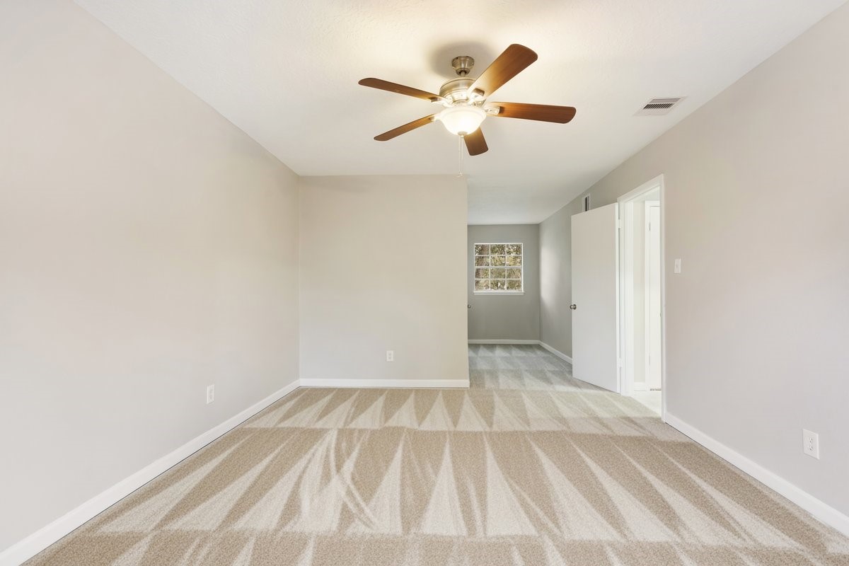 1403 Neptune Lane Houston, TX 77062 - Photo 15 of 20 a view of room with window and ceiling fan