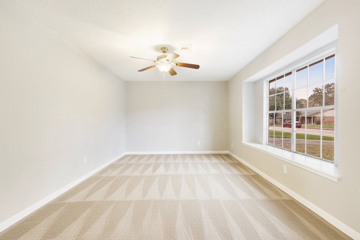 1403 Neptune Lane Houston, TX 77062 - Photo 8 of 20 a view of an empty room with a window