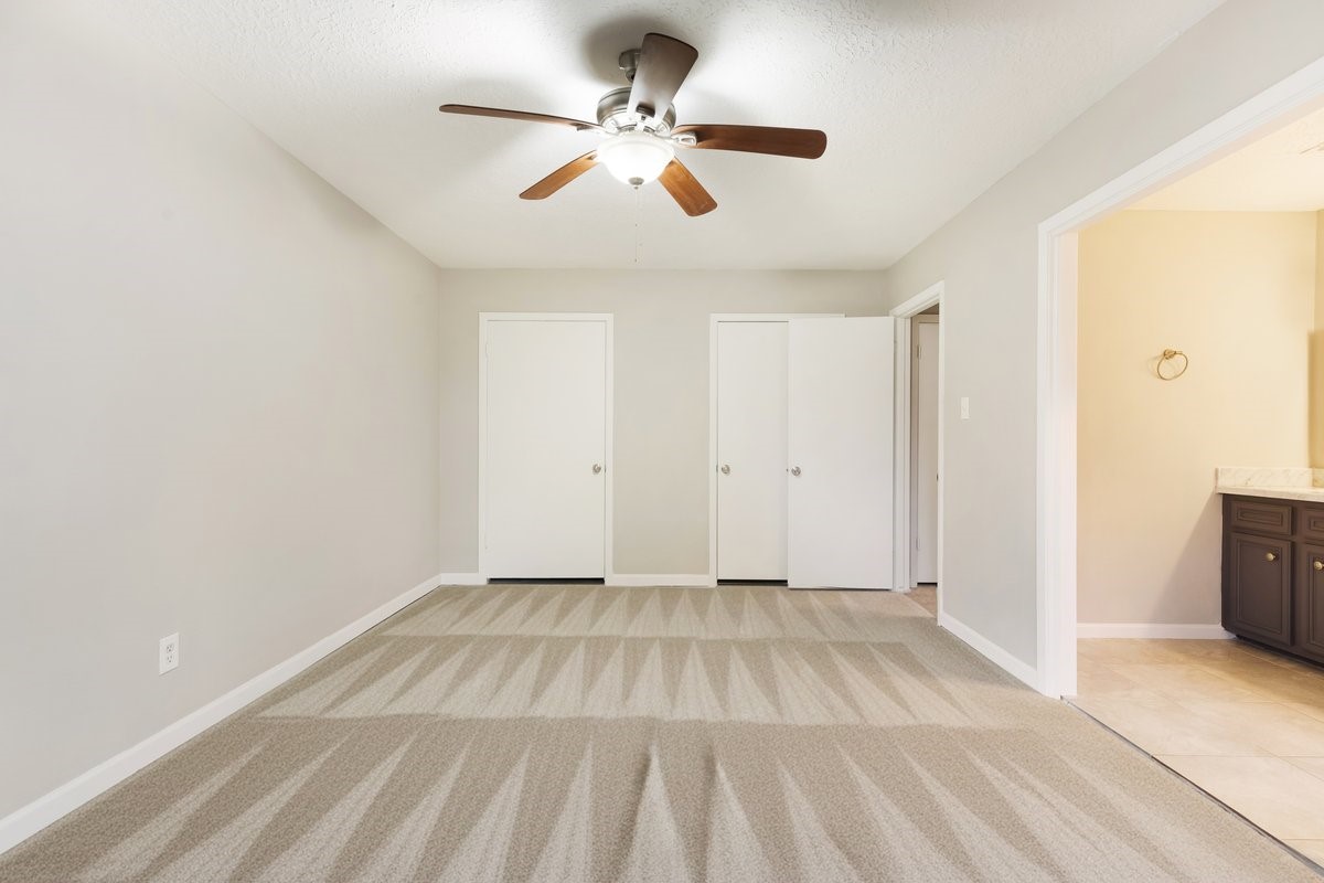 1403 Neptune Lane Houston, TX 77062 - Photo 10 of 20 a view of room with a ceiling fan