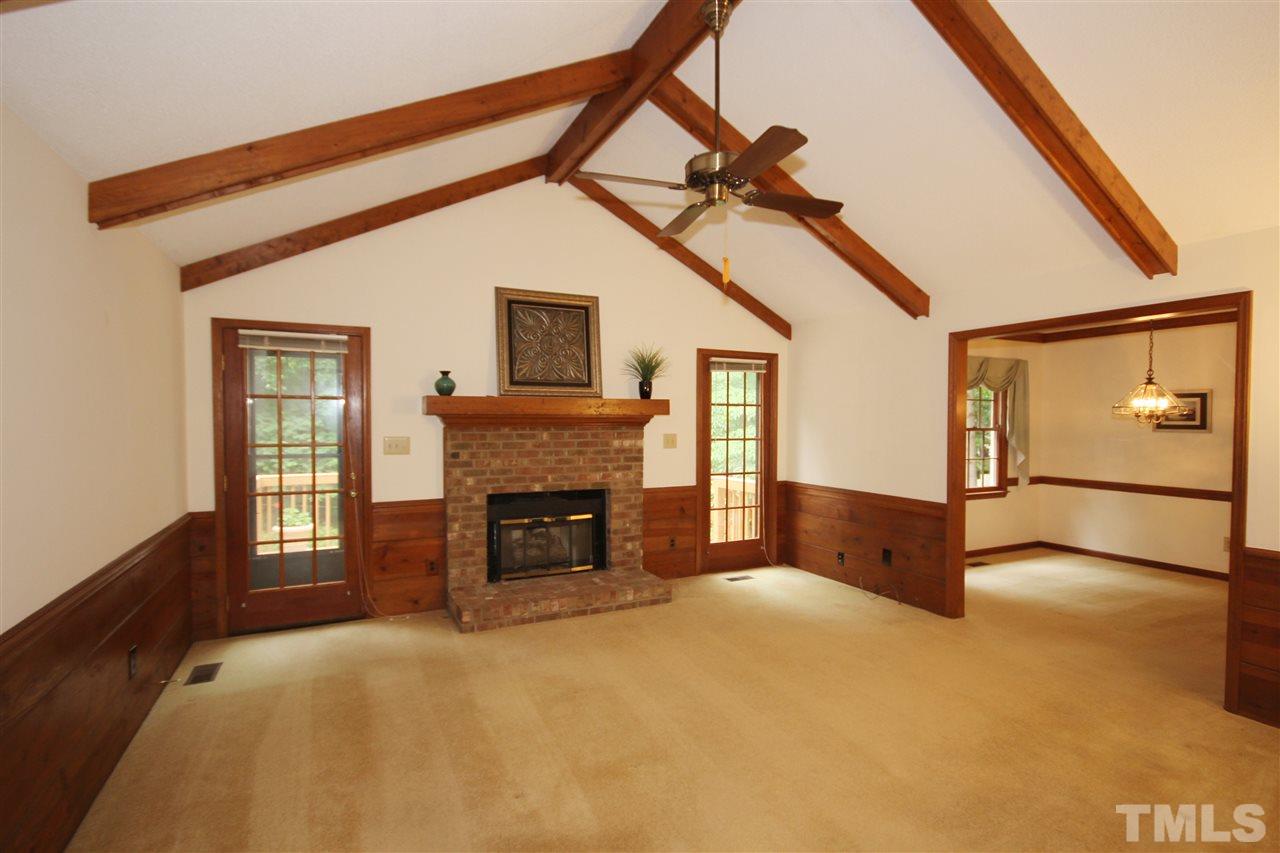 5305 Ridgeloch Place Raleigh, NC 27612 - Photo 2 of 23 a view of an empty room with window and fireplace