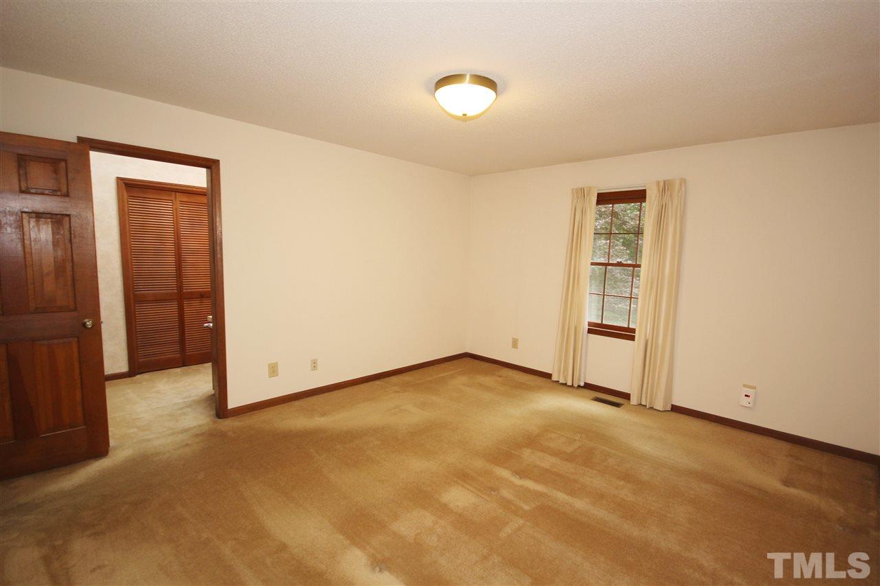 5305 Ridgeloch Place Raleigh, NC 27612 - Photo 14 of 23 an empty room with windows
