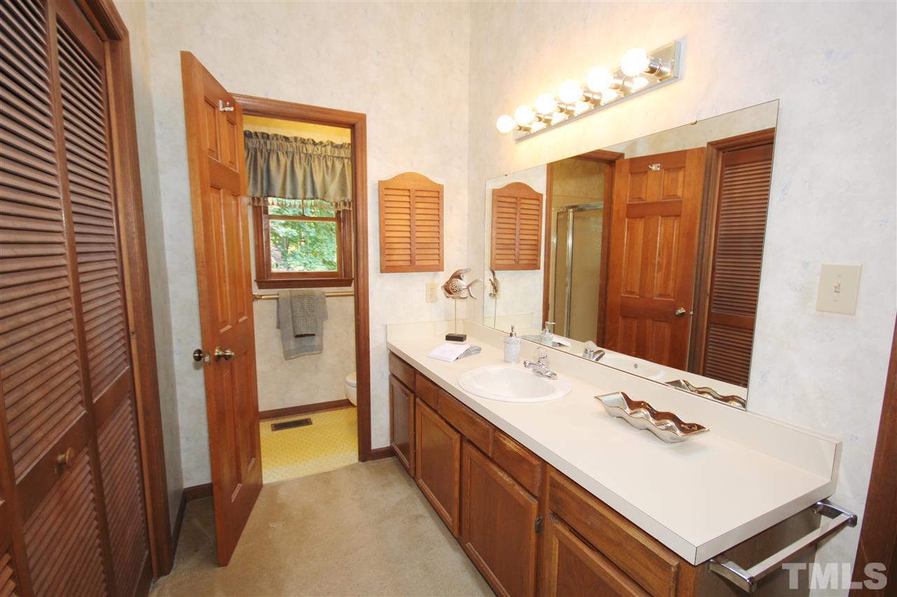 5305 Ridgeloch Place Raleigh, NC 27612 - Photo 15 of 23 a bathroom with a double vanity sink mirror and double