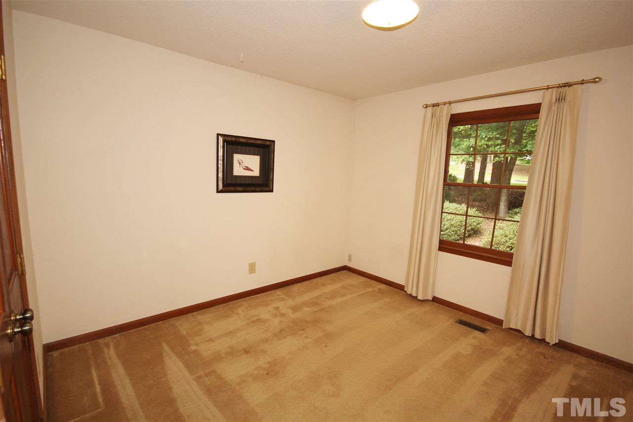 5305 Ridgeloch Place Raleigh, NC 27612 - Photo 18 of 23 an empty room with windows