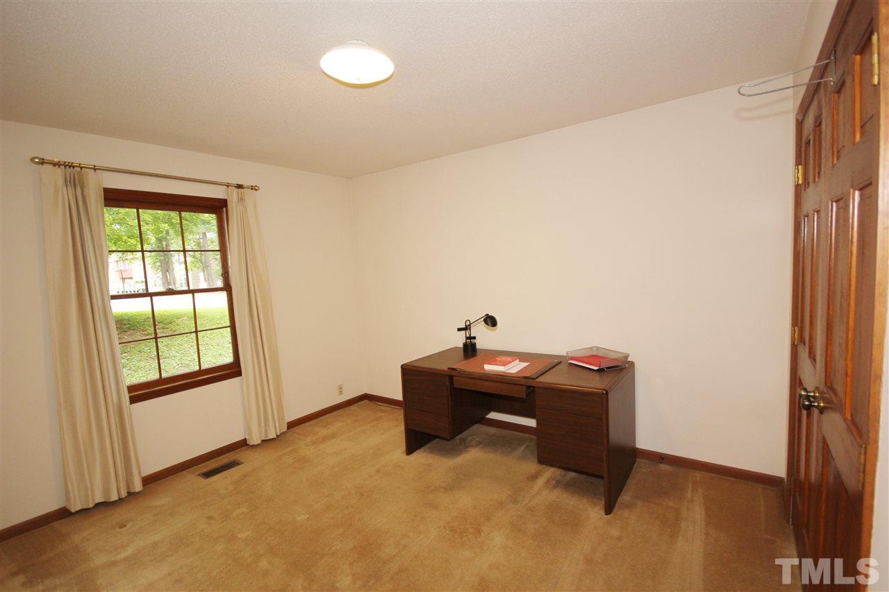 5305 Ridgeloch Place Raleigh, NC 27612 - Photo 19 of 23 an empty room with a window and wooden floor
