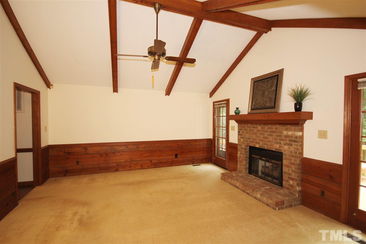 5305 Ridgeloch Place Raleigh, NC 27612 - Photo 3 of 23 a view of an empty room with furniture and fireplace