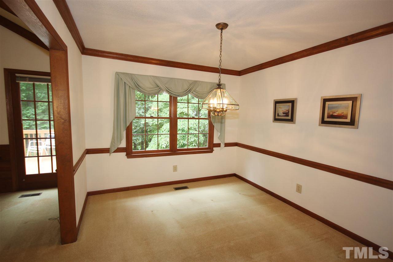 5305 Ridgeloch Place Raleigh, NC 27612 - Photo 4 of 23 a view of an empty room with a window