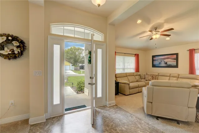 a living room with furniture and a window