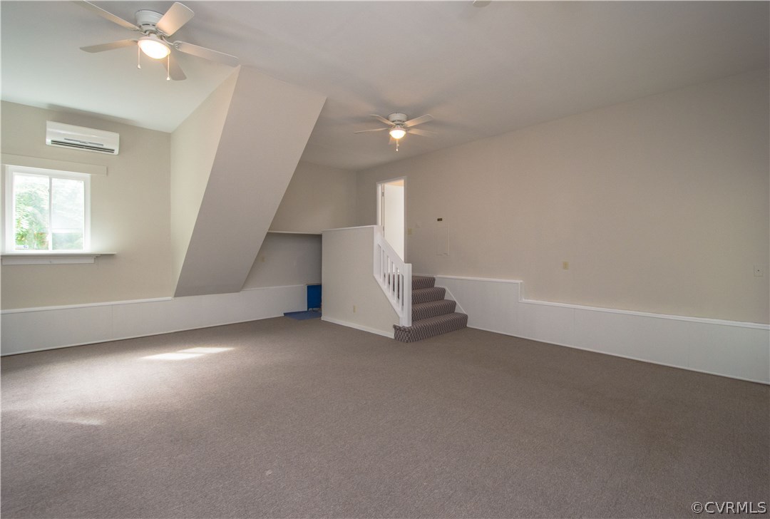 10634 Ramshorn Road Midlothian, VA 23113 - Photo 12 of 41 an empty room with windows and fan