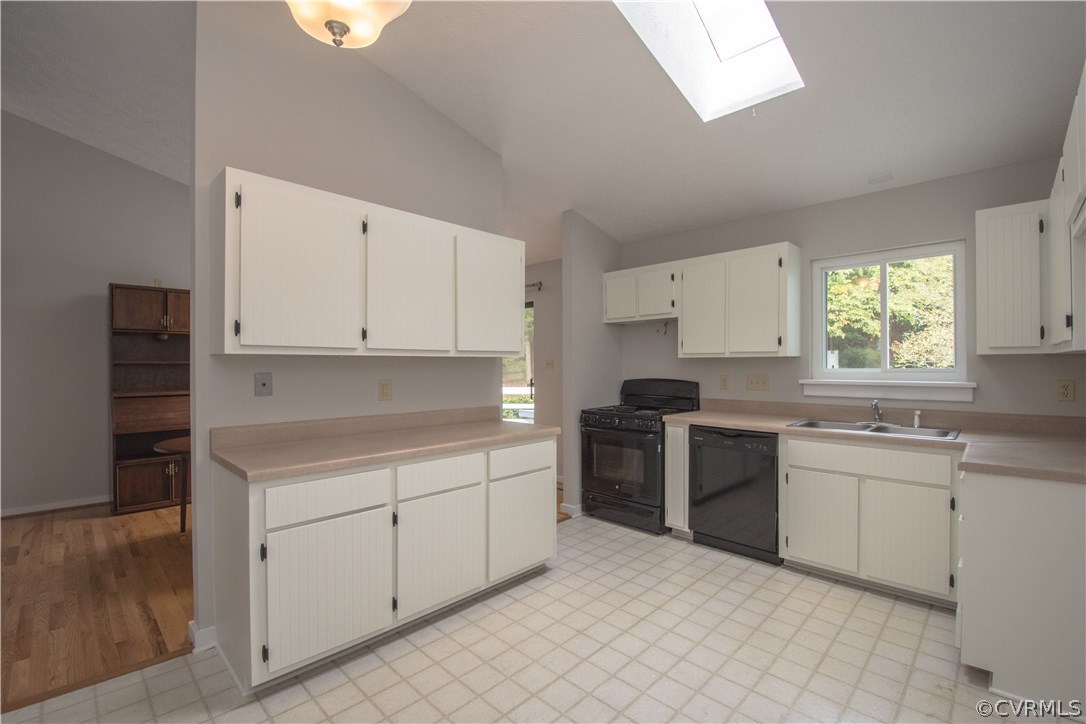 10634 Ramshorn Road Midlothian, VA 23113 - Photo 13 of 41 a kitchen with a sink stove and cabinets