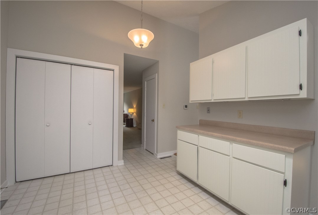 10634 Ramshorn Road Midlothian, VA 23113 - Photo 17 of 41 a view of a kitchen with white cabinets