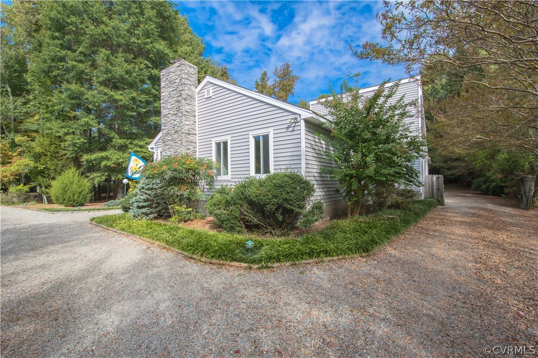 10634 Ramshorn Road Midlothian, VA 23113 - Photo 2 of 41 a view of a house with backyard and garden