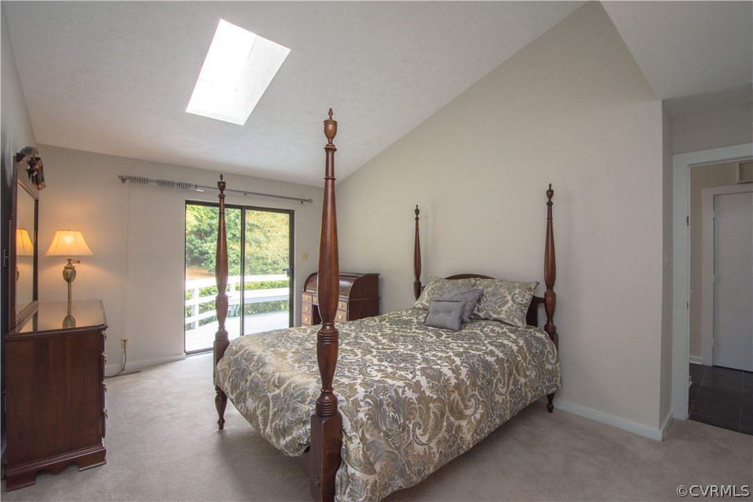 10634 Ramshorn Road Midlothian, VA 23113 - Photo 24 of 41 a bedroom with a large bed and a large window