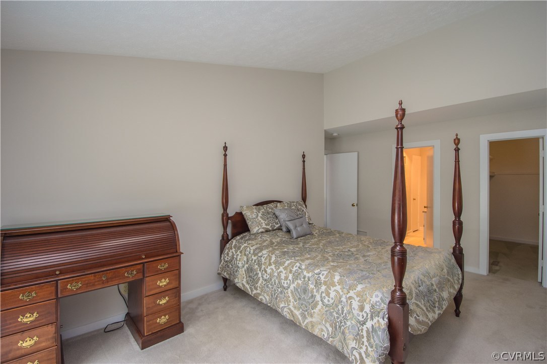 10634 Ramshorn Road Midlothian, VA 23113 - Photo 25 of 41 a bedroom with a bed and a dresser