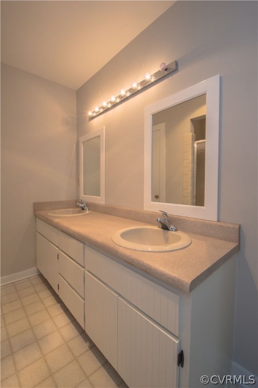 10634 Ramshorn Road Midlothian, VA 23113 - Photo 28 of 41 a bathroom with a sink and a mirror