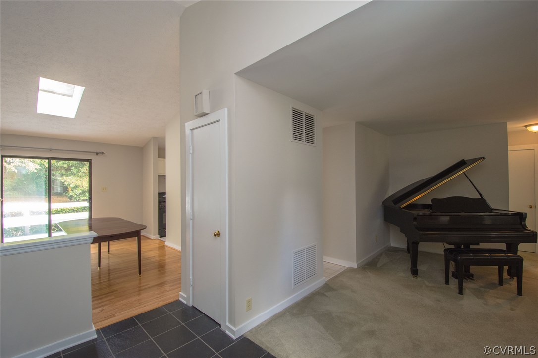 10634 Ramshorn Road Midlothian, VA 23113 - Photo 6 of 41 a living room with furniture a piano and a window