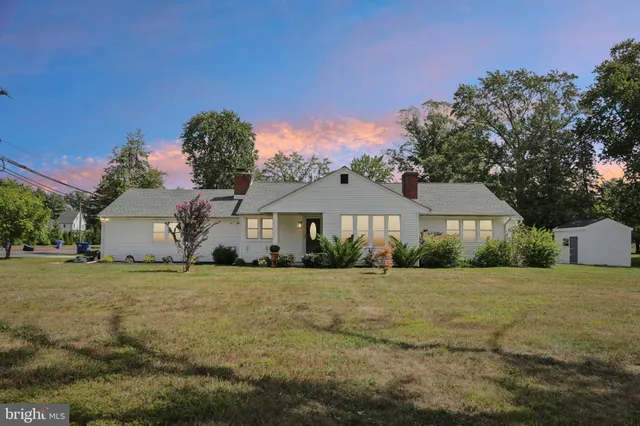 a house that has a tree in front of it
