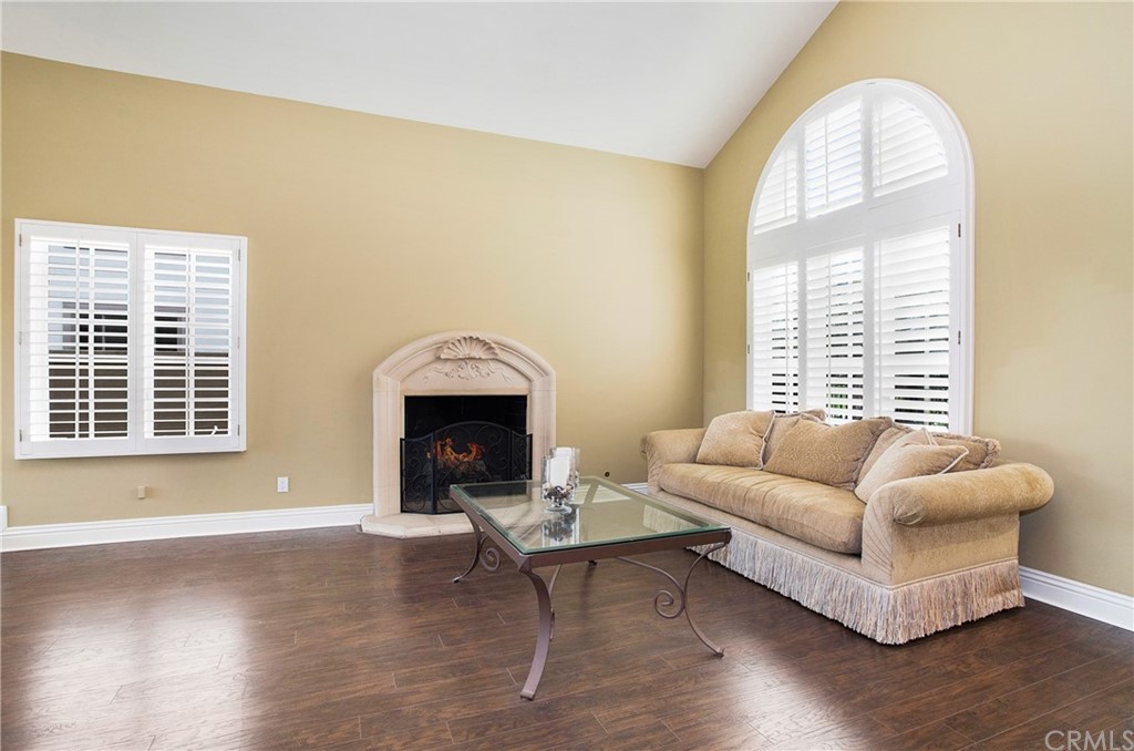 16 Bethany Laguna Niguel, CA 92677 - Photo 12 of 38 a living room with furniture and a fireplace
