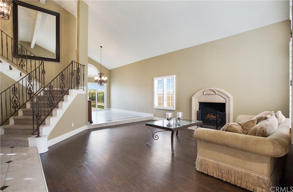 16 Bethany Laguna Niguel, CA 92677 - Photo 15 of 38 a living room with furniture and a fireplace
