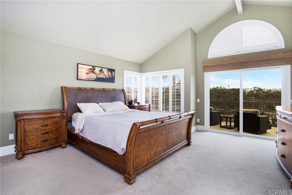 16 Bethany Laguna Niguel, CA 92677 - Photo 22 of 38 a bed sitting in a spacious bedroom next to a window