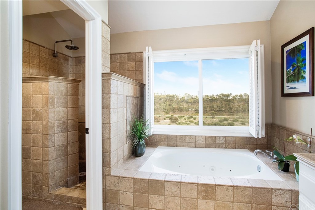 16 Bethany Laguna Niguel, CA 92677 - Photo 26 of 38 a bathroom with a bathtub and shower