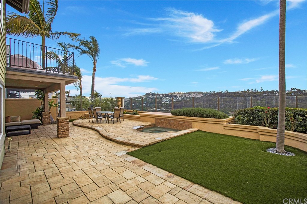 16 Bethany Laguna Niguel, CA 92677 - Photo 5 of 38 a view of a swimming pool with lawn chairs and a fire pit