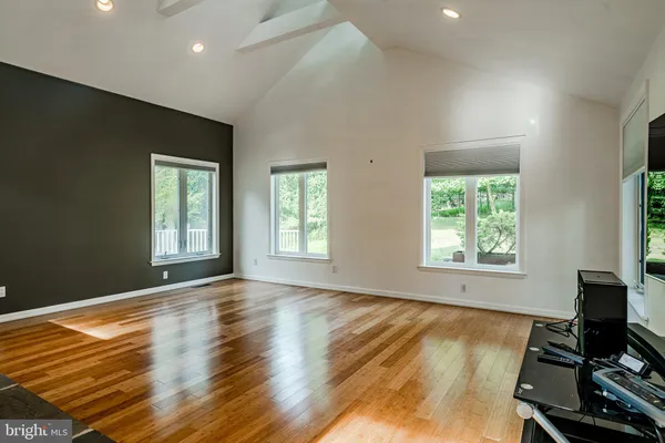a view of room with window and wooden floor