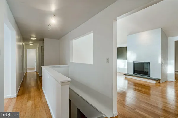 an empty room with mirror in closet