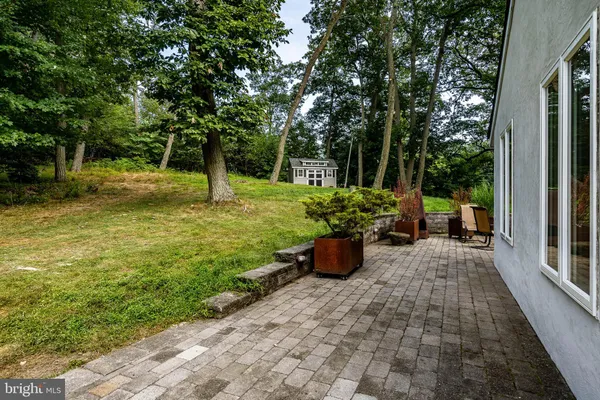 a view of a backyard with sitting area
