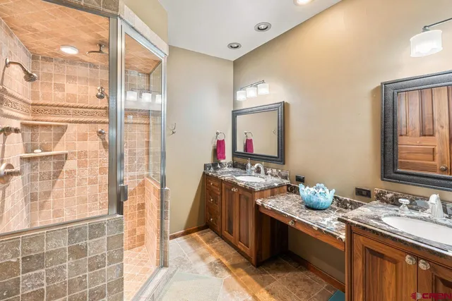 a view of a balcony with wooden floor and fence