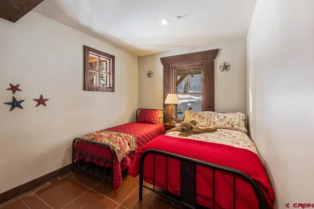 a bathroom with a granite countertop sink mirror and a shower