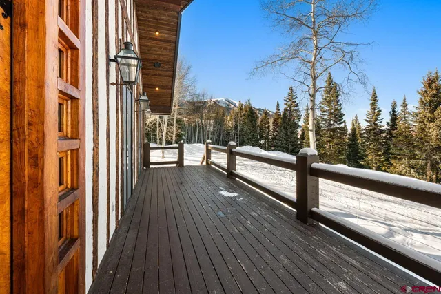 a view of a balcony with trees