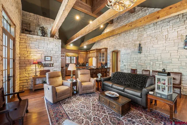 a outdoor living space with patio furniture and a rug