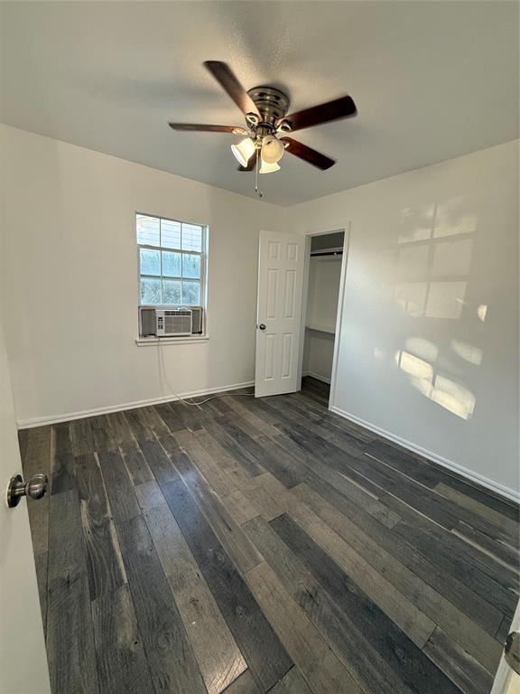 2529 Rutgers Drive Irving, TX 75062 - Photo 11 of 38 wooden floor in an empty room with a window