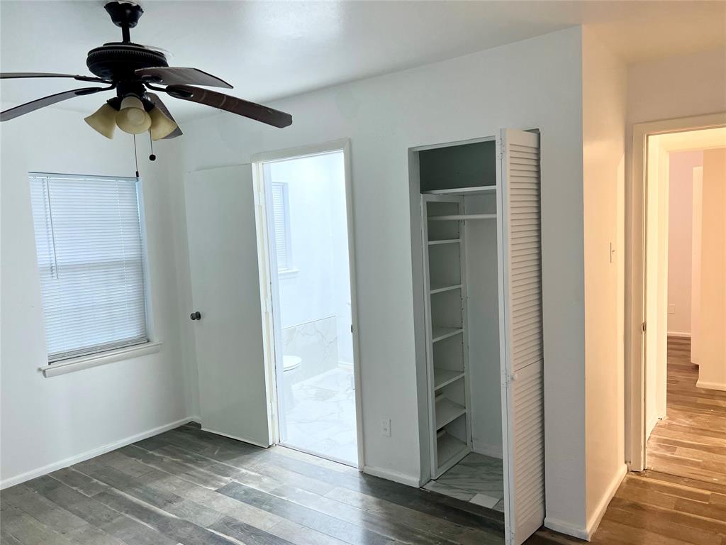 2529 Rutgers Drive Irving, TX 75062 - Photo 23 of 38 a view of hallway with walk in closet and window