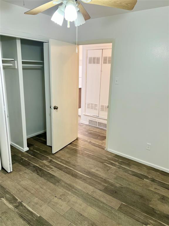 2529 Rutgers Drive Irving, TX 75062 - Photo 27 of 38 an empty room with wooden floor fan and window