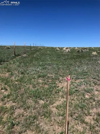 a view of a road with a building in the background