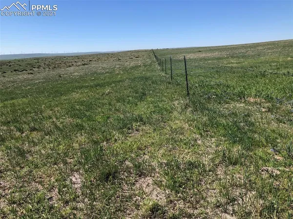 a view of a field with an outdoor space