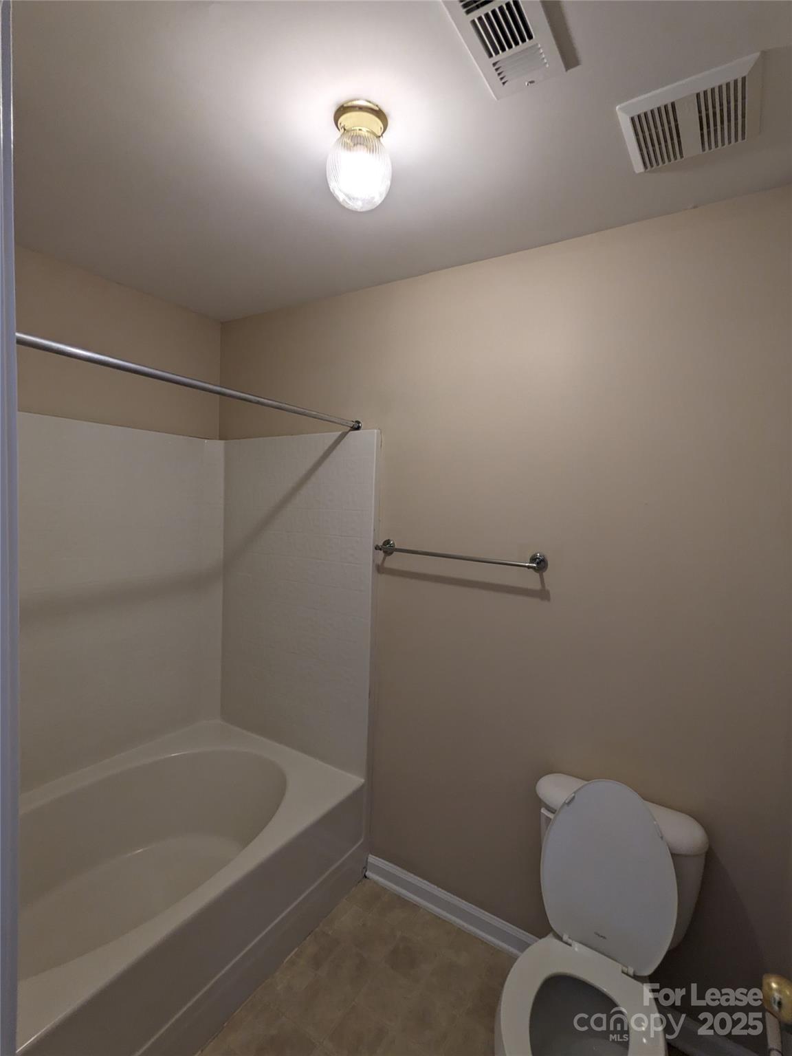 4934 Prosperity Ridge Road Charlotte, NC 28269 - Photo 12 of 15 a bathroom with a toilet and a shower