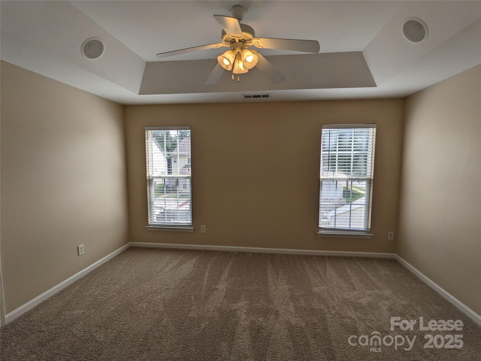 4934 Prosperity Ridge Road Charlotte, NC 28269 - Photo 9 of 15 a view of an empty room with window and chandelier fan