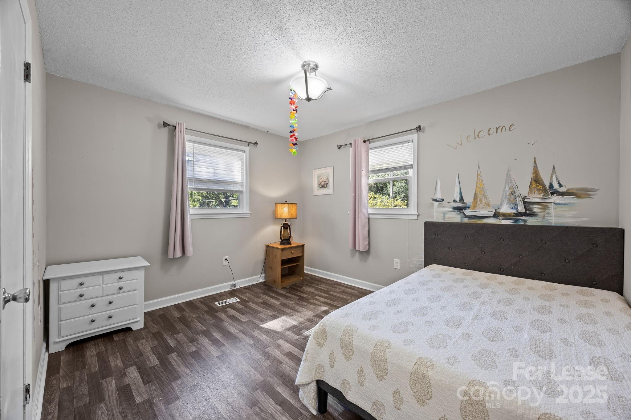 10751 Ola Drive Fort Mill, SC 29707 - Photo 12 of 22 a bedroom with a bed and a dresser