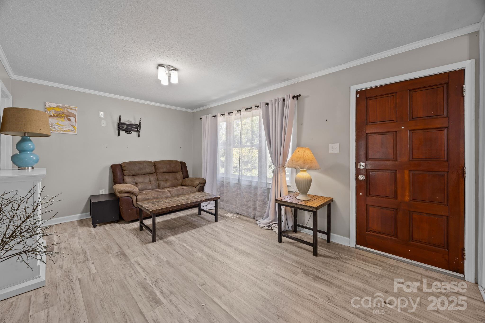 10751 Ola Drive Fort Mill, SC 29707 - Photo 2 of 22 a living room with furniture and a wooden floor