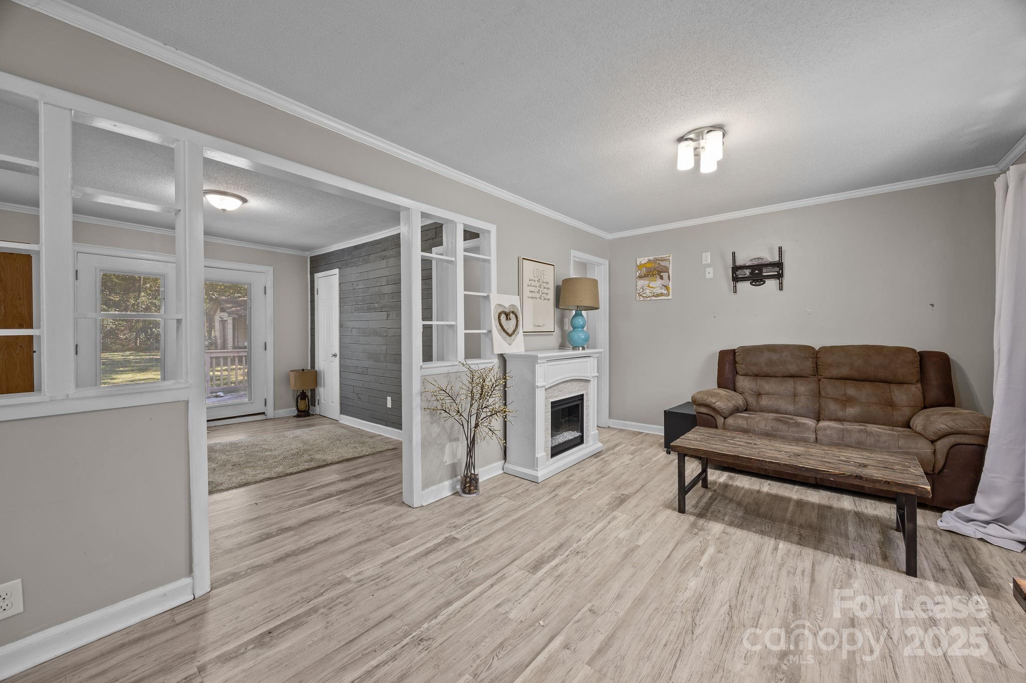 10751 Ola Drive Fort Mill, SC 29707 - Photo 3 of 22 a living room with furniture and a wooden floor